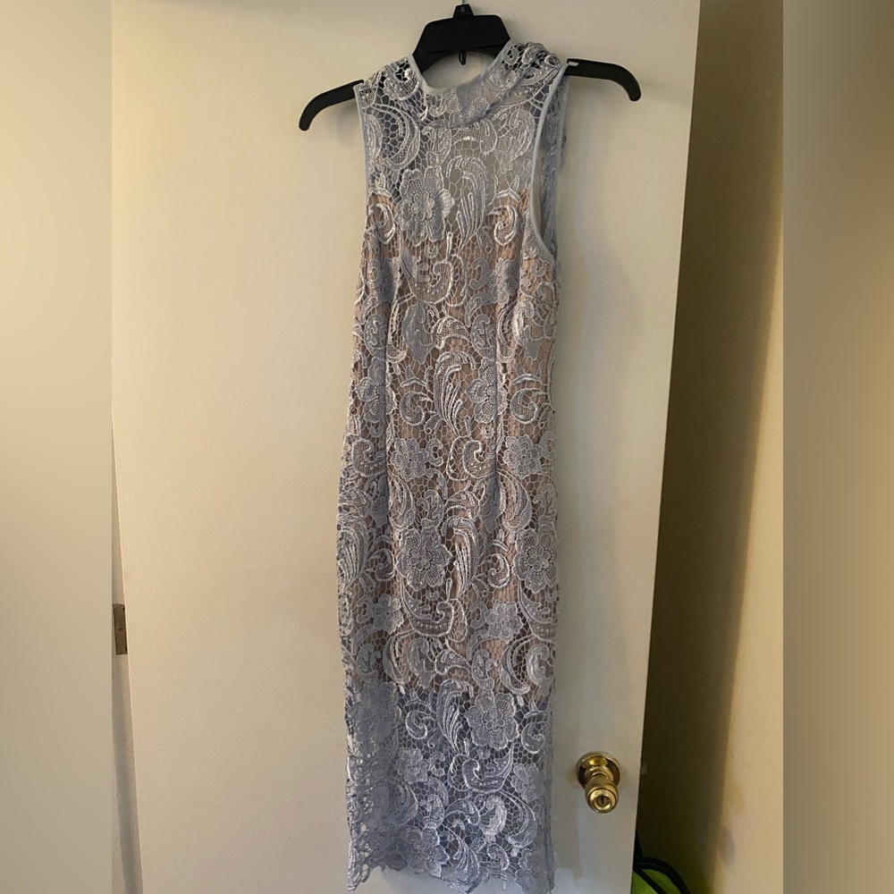 Lace knee length fitted dress and open back